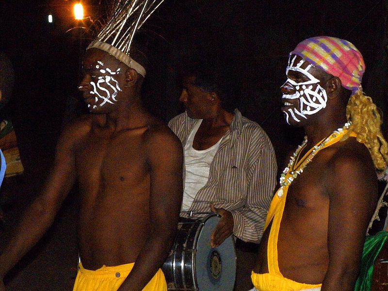 A group of men wearing face paint Description automatically generated with low confidence